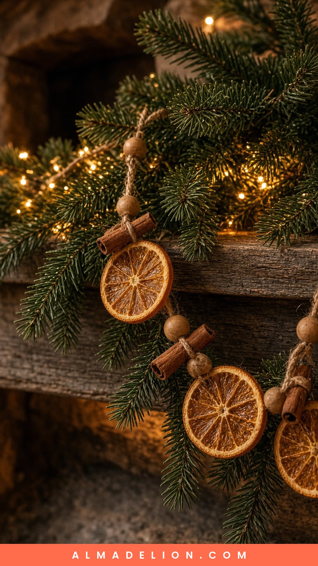 Handmade dried orange slice and cinnamon stick garland draped over a Christmas mantel