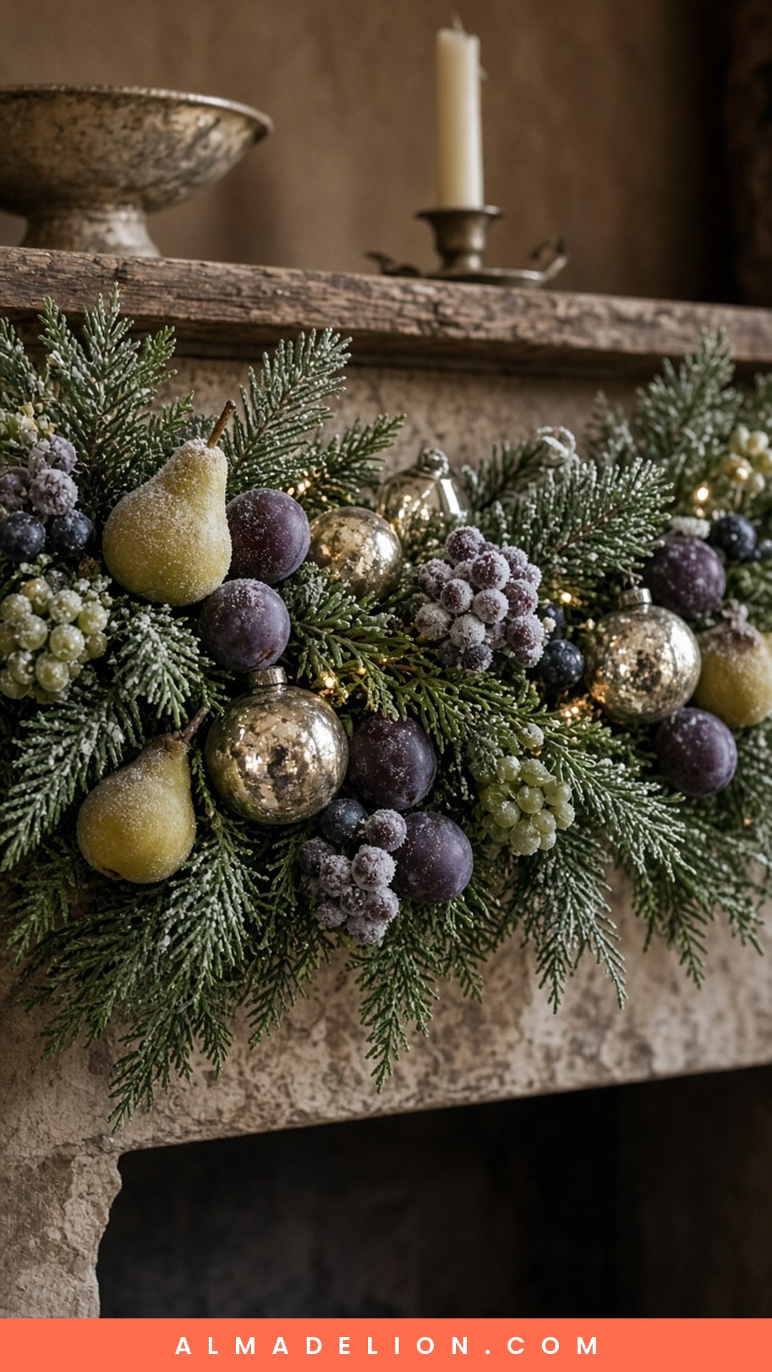 Sugared fruit ornaments and vintage glass baubles tucked into a Christmas mantel garland